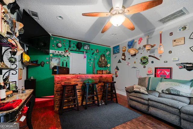 an aerial view of a house with a swimming pool