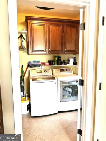 a view of pool with yard