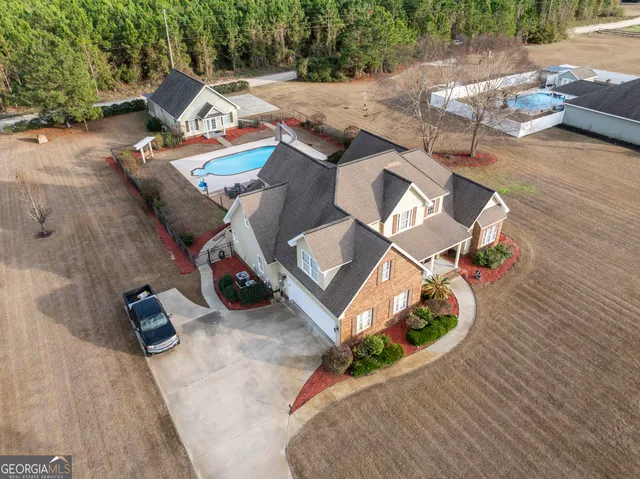 a view of a car park in front of house