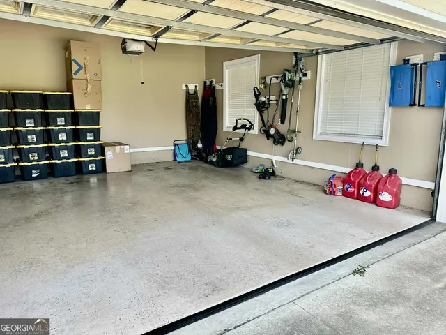 a front view of a house with yard and green space