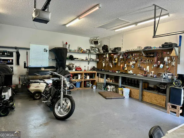 a view of a house with a garden and yard