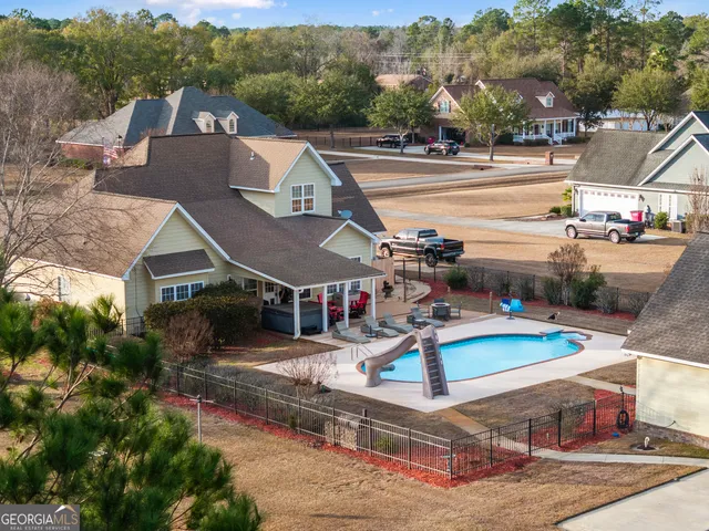 an aerial view of residential house with outdoor space