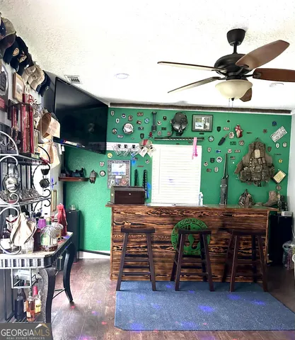 a view of a house with swimming pool and sitting area
