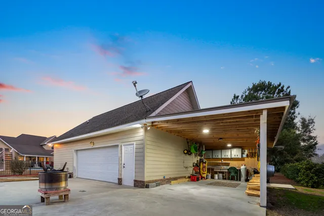a kitchen with granite countertop a refrigerator stove top oven and sink