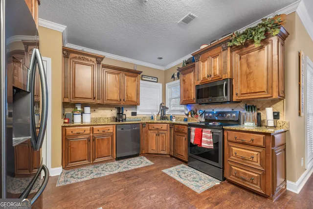 a dining room with furniture a chandelier and wooden floor