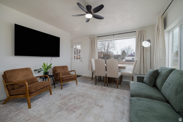 479 South 100 West Vernal, UT 84078 - Photo 3 of 13 Living area featuring ceiling fan, plenty of natural light, and wood finished floors