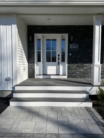 a view of entryway with a fireplace