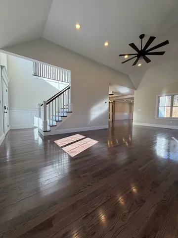 a view of entryway and hall with wooden floor