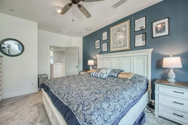 a bedroom with furniture and a window