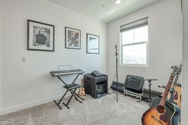 a view of a livingroom with furniture and a potted plant