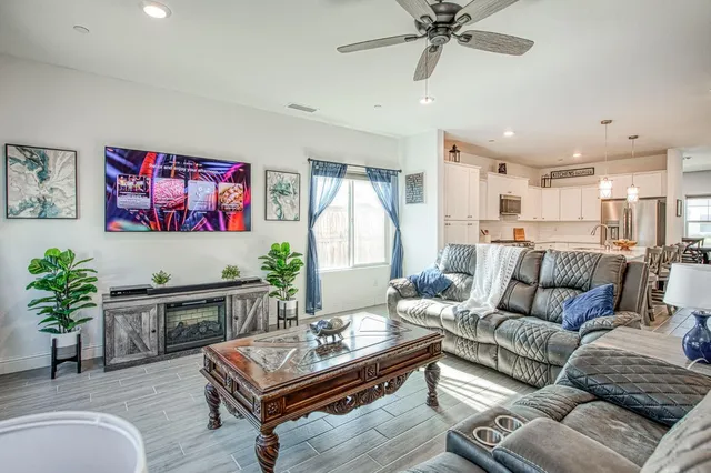 a bathroom with a granite countertop sink mirror and shower