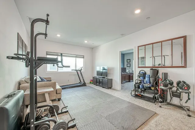 a bathroom with a double vanity sink toilet and a mirror