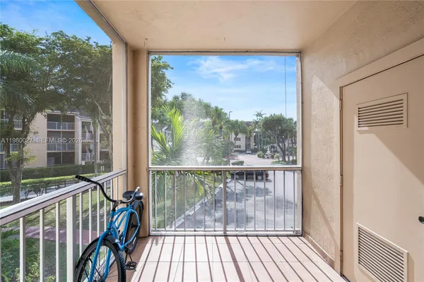 a view of a balcony with furniture