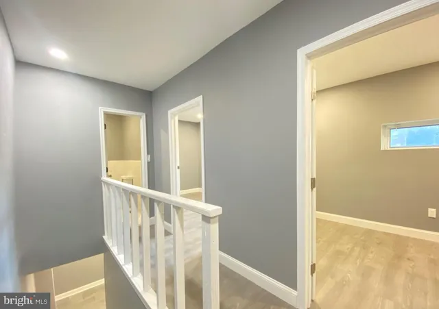 a view of a hallway with a window