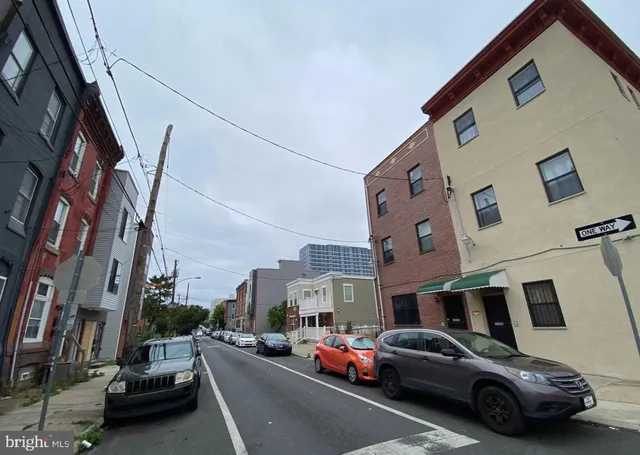 a view of car parked in front of a building