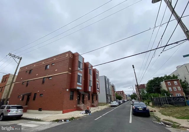 a view of a street with cars
