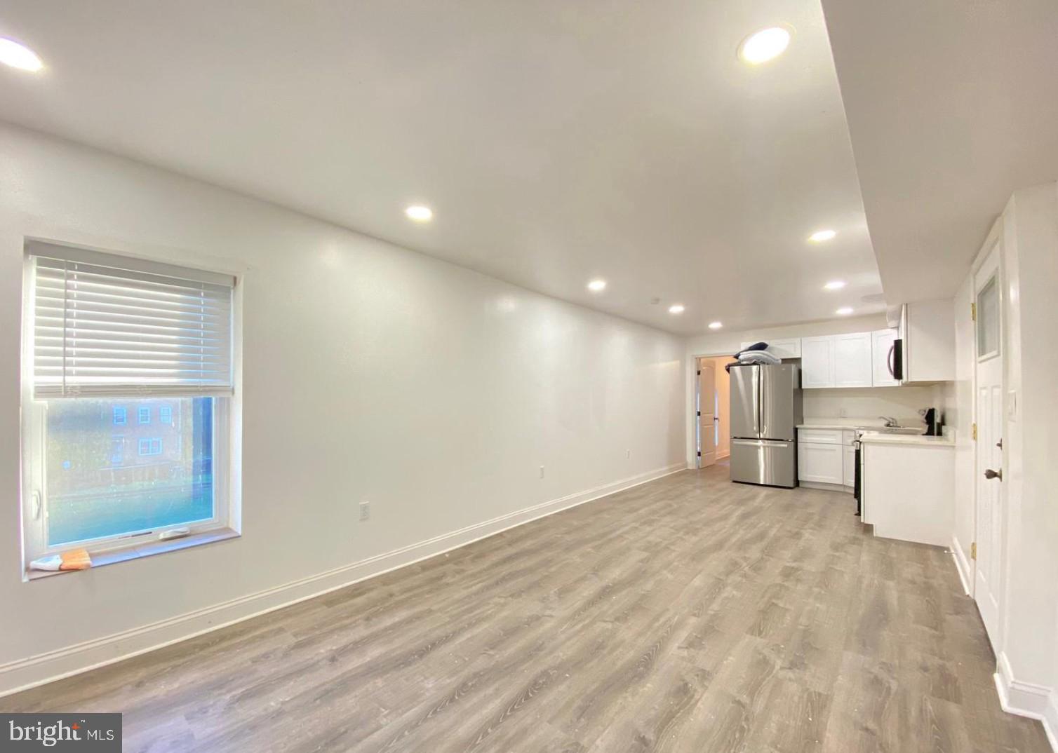 1230 North 15th Street Philadelphia, PA 19121 - Photo 4 of 31 a view of a kitchen with a sink and a refrigerator
