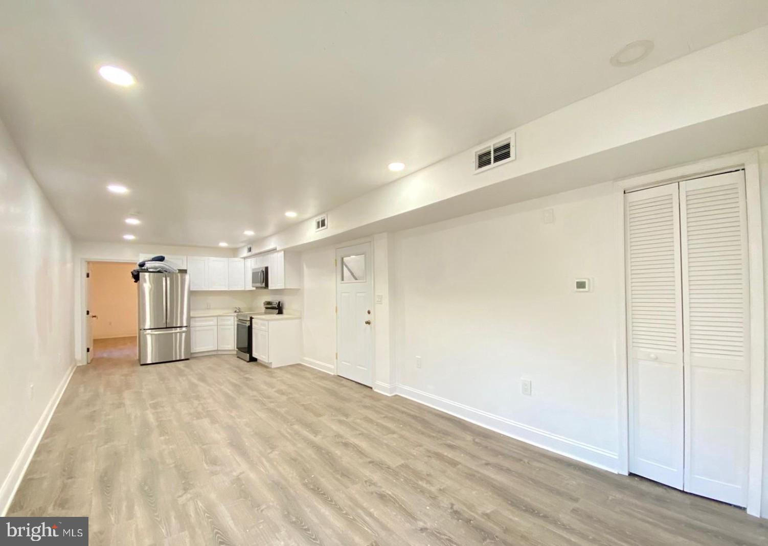 1230 North 15th Street Philadelphia, PA 19121 - Photo 5 of 31 a view of a kitchen with a refrigerator and a sink