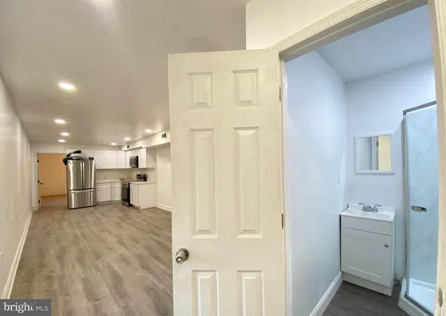 a view of a storage & utility room with two washing machine