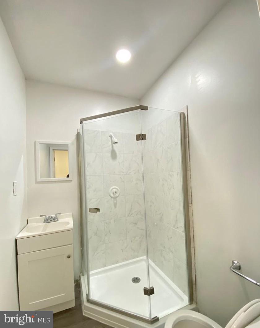 1230 North 15th Street Philadelphia, PA 19121 - Photo 7 of 31 a bathroom with a shower a toilet and sink
