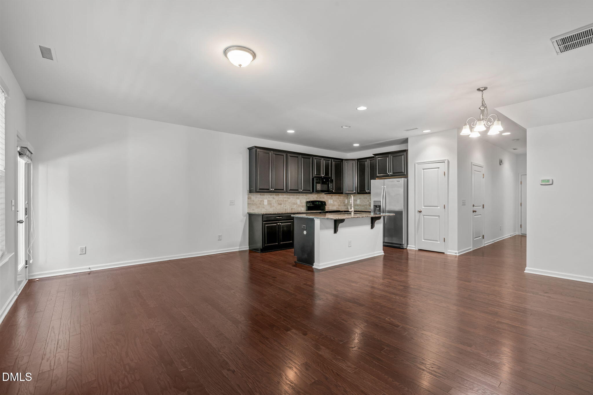 102 Ransomwood Drive Apex, NC 27539 - Photo 14 of 34 a view of kitchen with cabinets and wooden floor