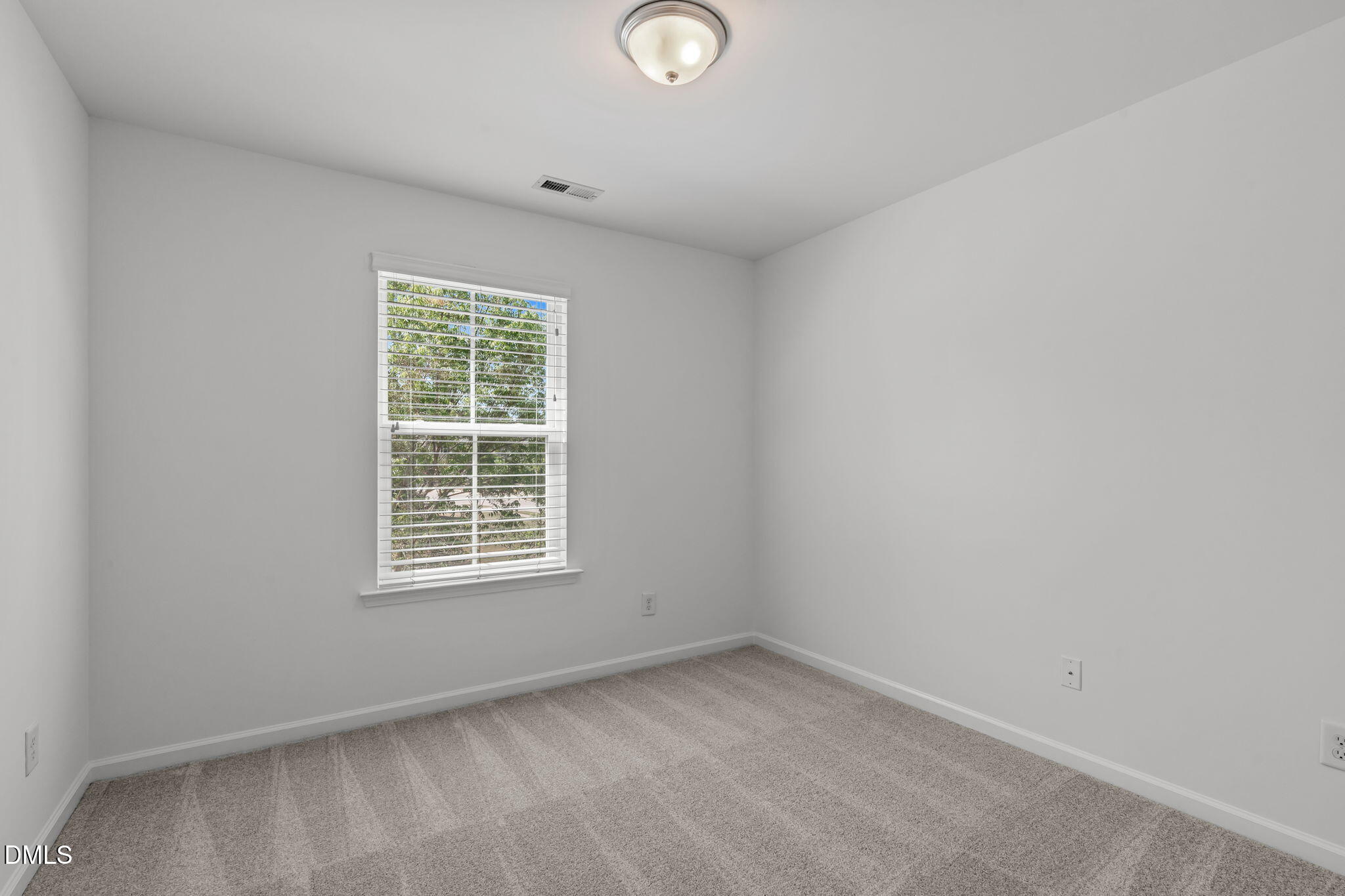 102 Ransomwood Drive Apex, NC 27539 - Photo 17 of 34 an empty room with a window