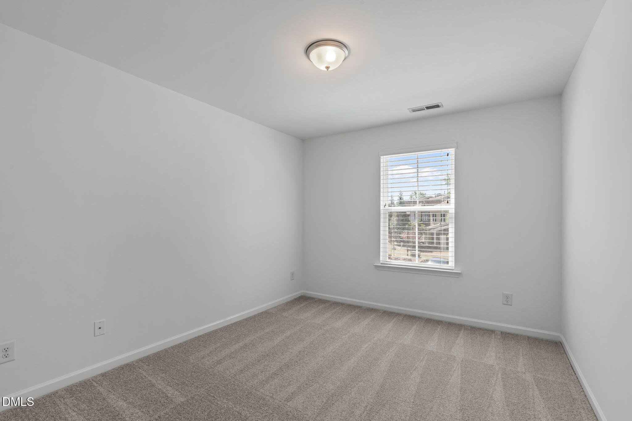 102 Ransomwood Drive Apex, NC 27539 - Photo 20 of 34 an empty room with a window