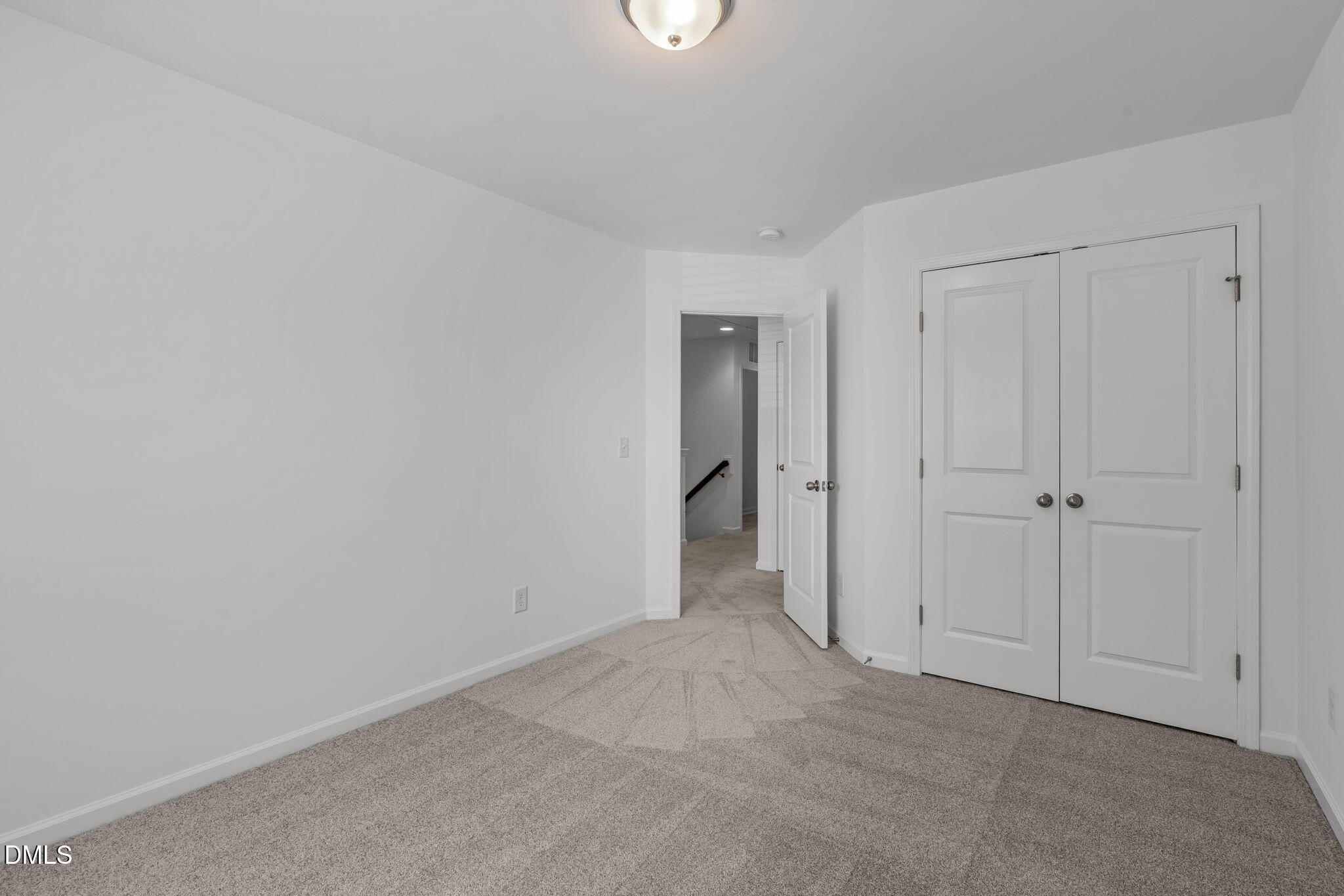 102 Ransomwood Drive Apex, NC 27539 - Photo 21 of 34 a view of an empty room with closet area