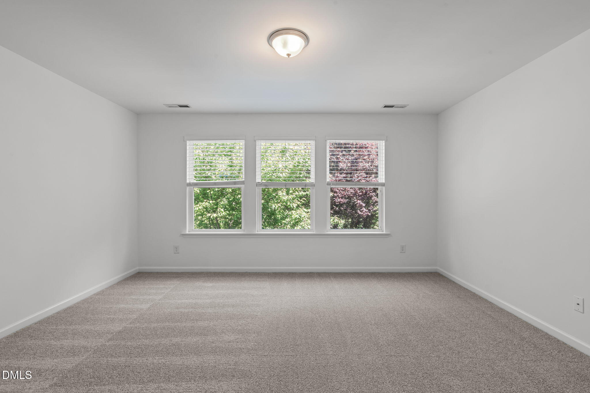 102 Ransomwood Drive Apex, NC 27539 - Photo 22 of 34 an empty room with a window