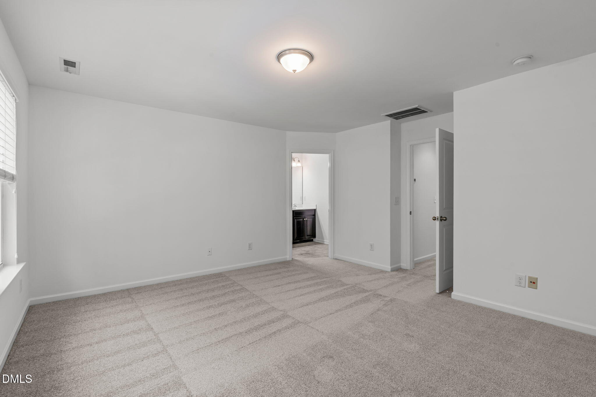 102 Ransomwood Drive Apex, NC 27539 - Photo 23 of 34 a view of an empty room and a window
