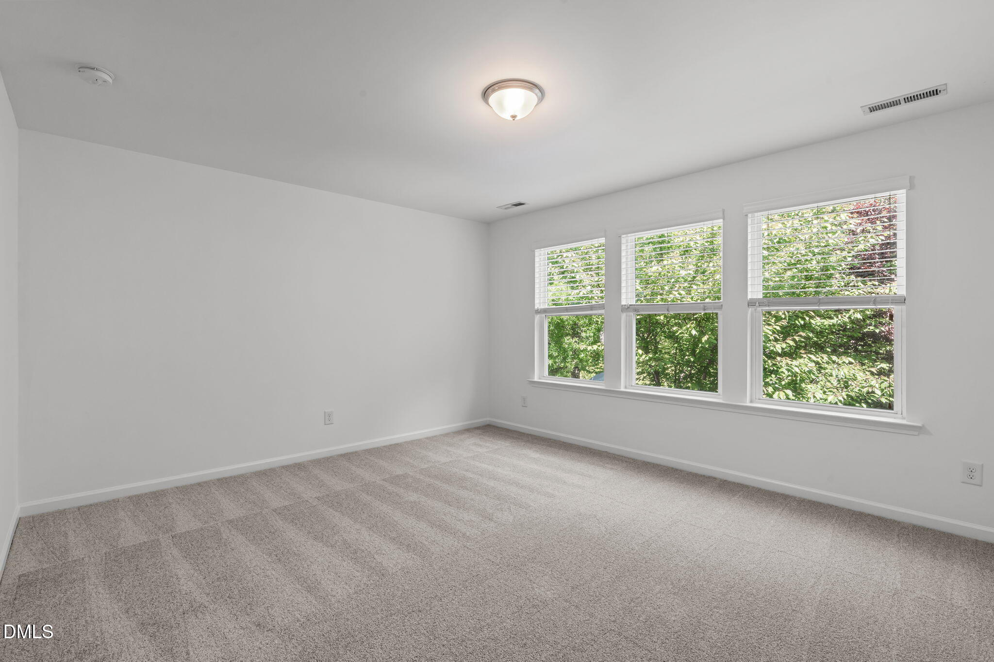 102 Ransomwood Drive Apex, NC 27539 - Photo 24 of 34 an empty room with a window