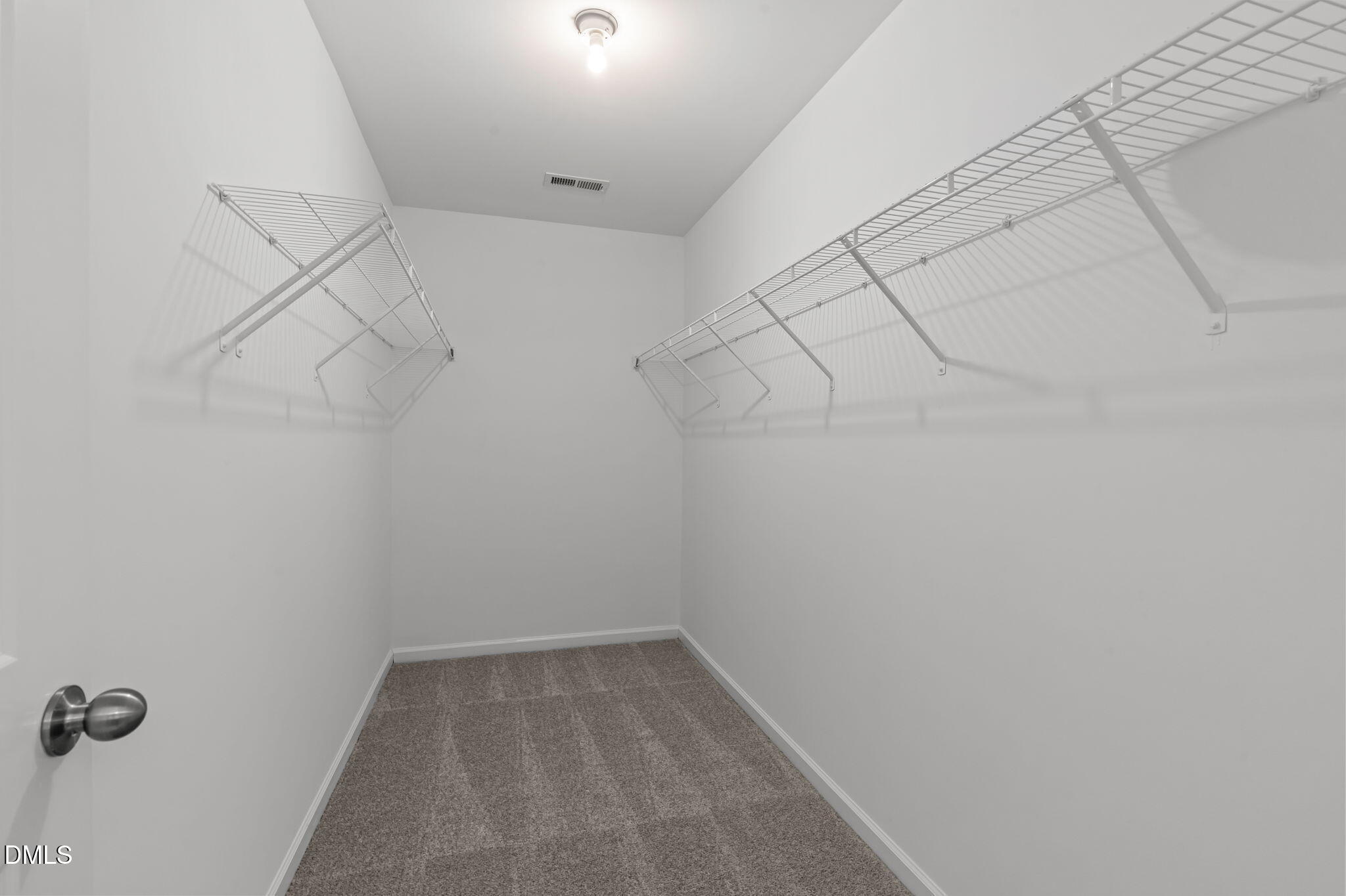 102 Ransomwood Drive Apex, NC 27539 - Photo 27 of 34 a view of a room with racks on the wall
