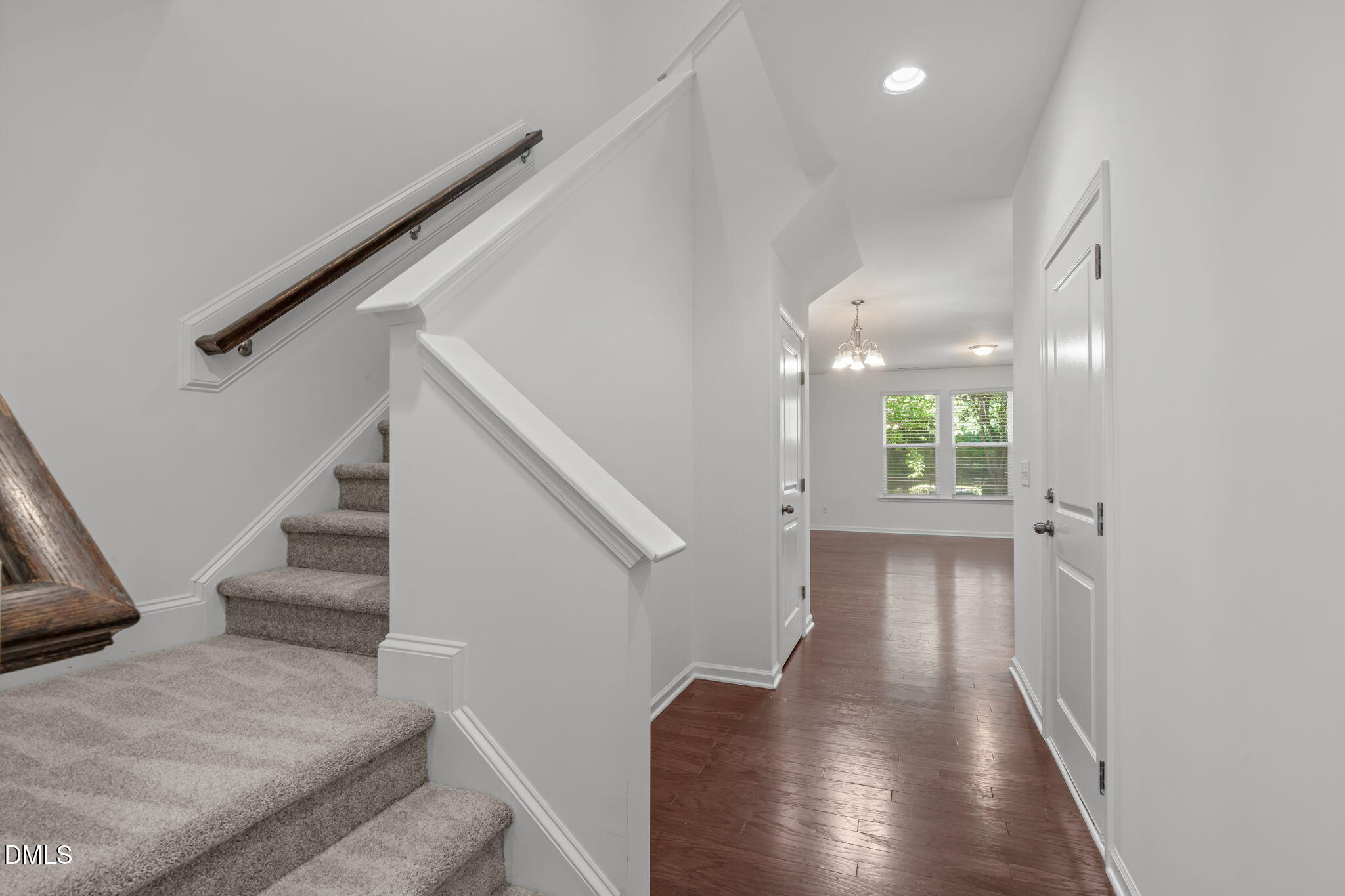 102 Ransomwood Drive Apex, NC 27539 - Photo 4 of 34 a view of entryway and hall with wooden floor