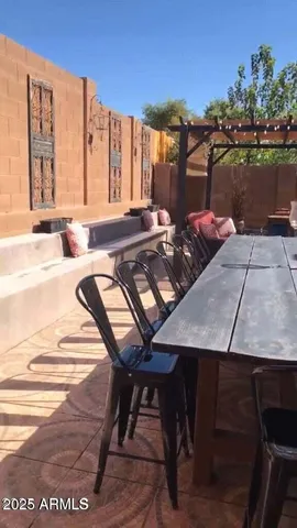 a view of a terrace with furniture and stove