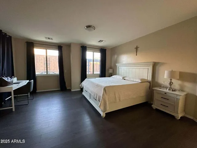 a bedroom with a bed and window