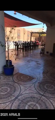 a view of swimming pool with outdoor seating