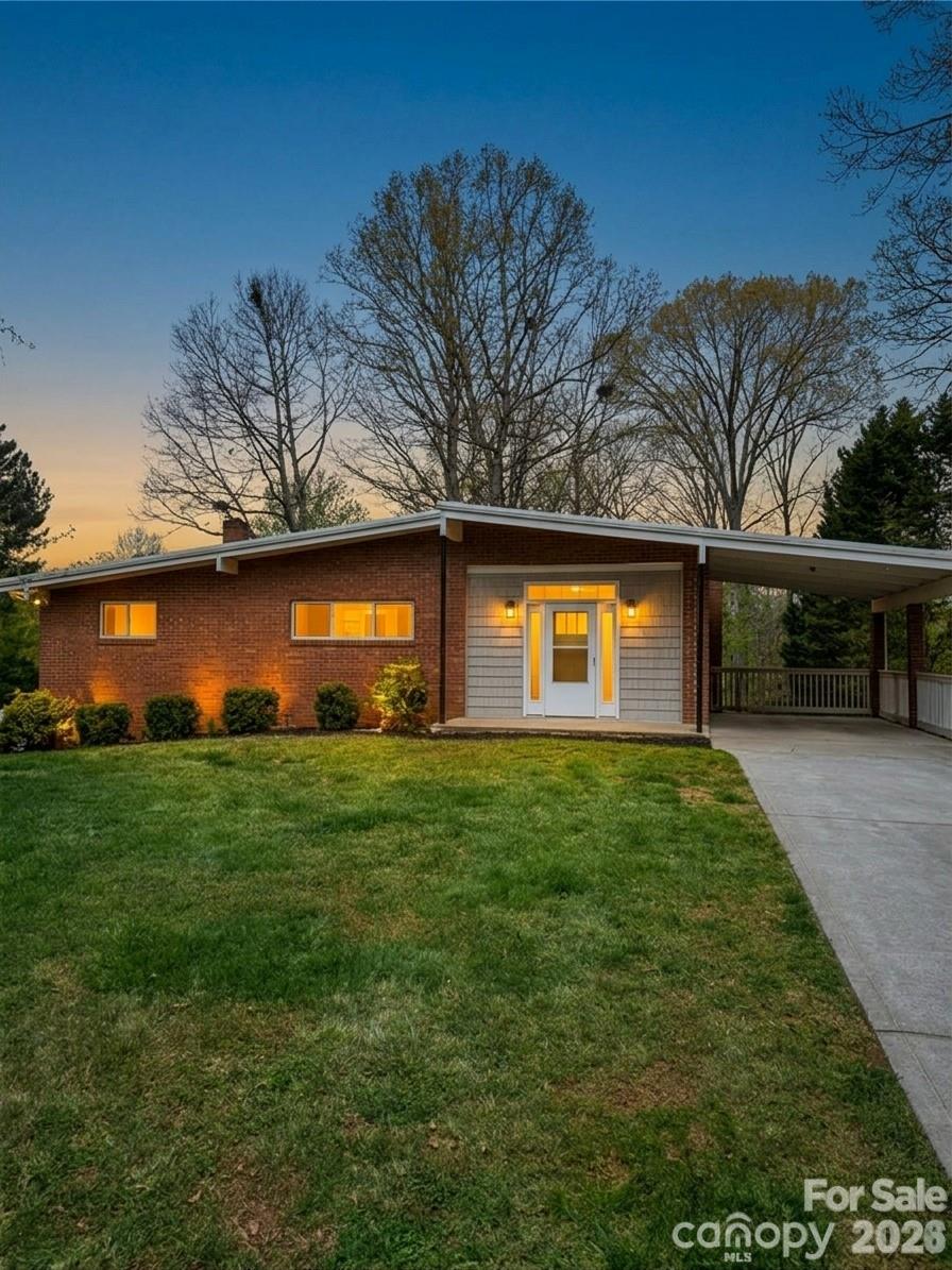 a view of house with backyard space