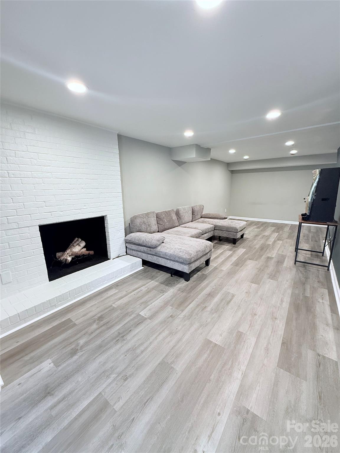 3743 Crosland Road Winston-Salem, NC 27106 - Photo 12 of 25 a living room with furniture and a flat screen tv
