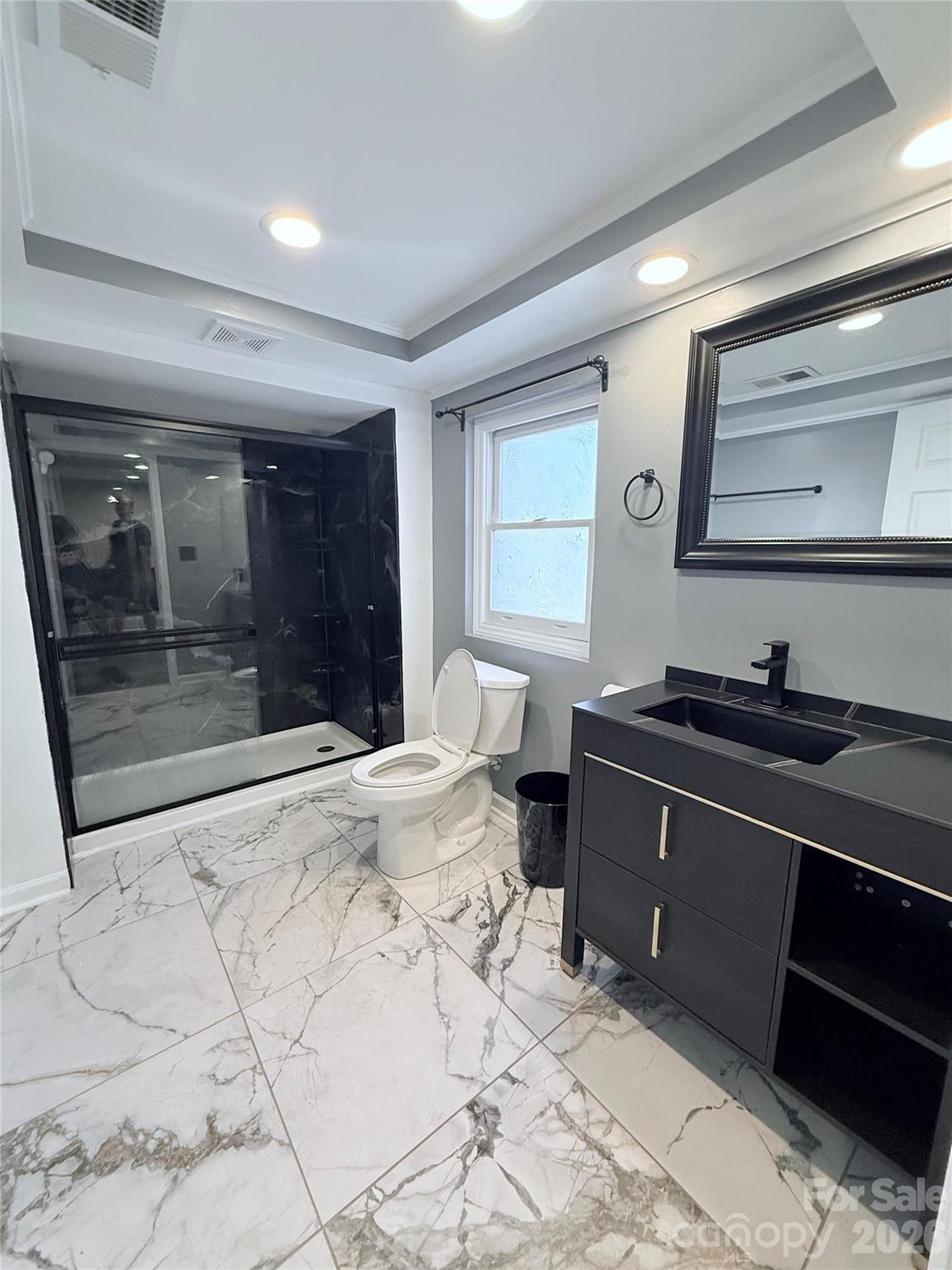 3743 Crosland Road Winston-Salem, NC 27106 - Photo 14 of 25 a room with a bed and a mirror