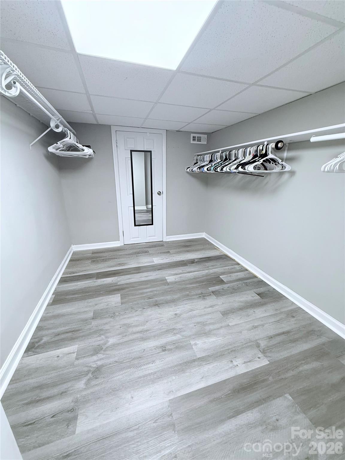 3743 Crosland Road Winston-Salem, NC 27106 - Photo 15 of 25 a view of a room with stairs and a chandelier