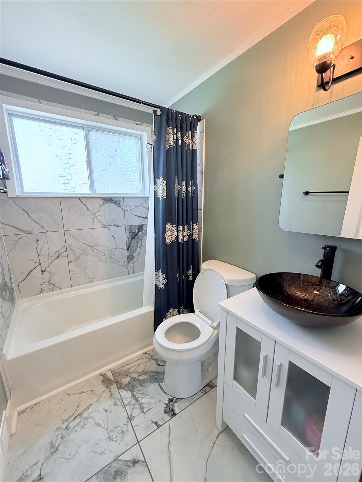 3743 Crosland Road Winston-Salem, NC 27106 - Photo 9 of 25 a bathroom with a sink toilet and shower