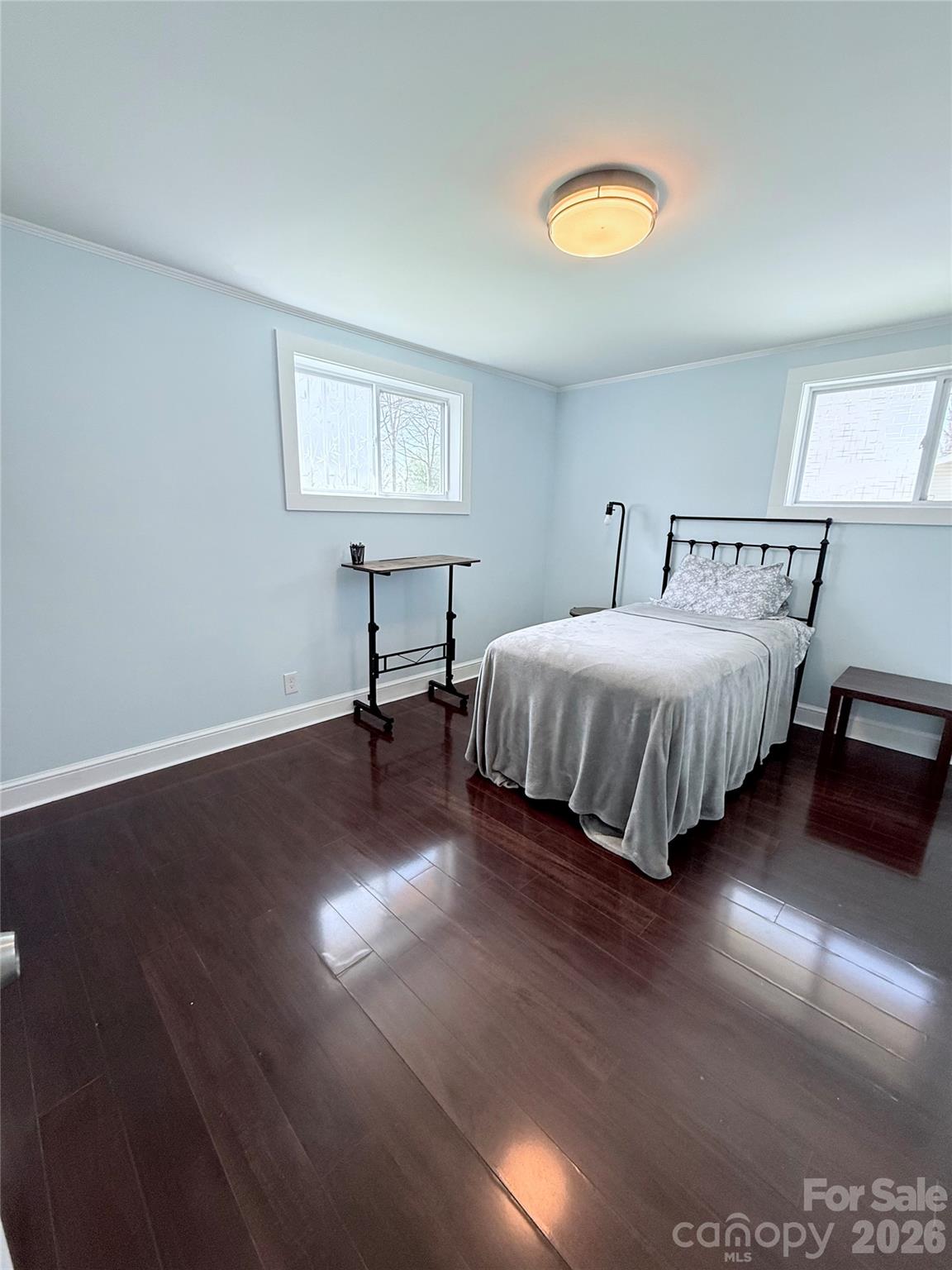 3743 Crosland Road Winston-Salem, NC 27106 - Photo 10 of 25 a bedroom with a bed and a lamp