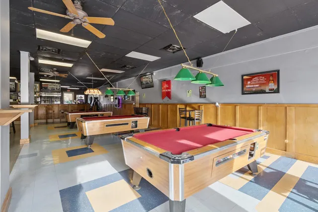 a open kitchen with lots of clutter and cabinets