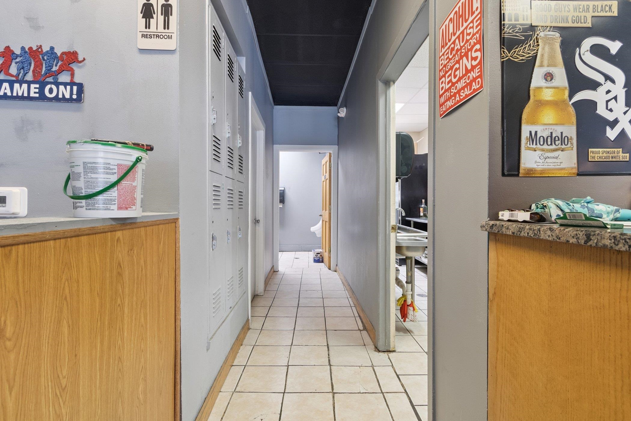 522 South State Street Belvidere, IL 61008 - Photo 22 of 67 a hallway with painting on the wall and a large mirror