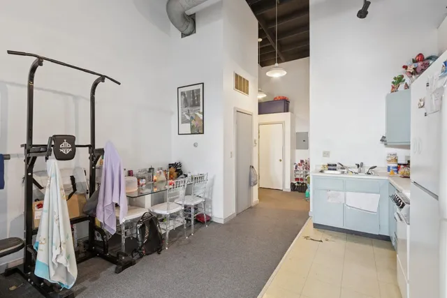 a bathroom with a toilet sink and shower