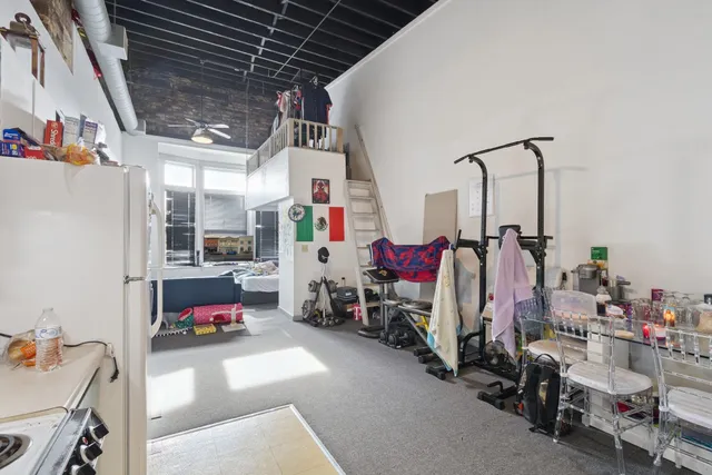 a car parked in front of a brick house