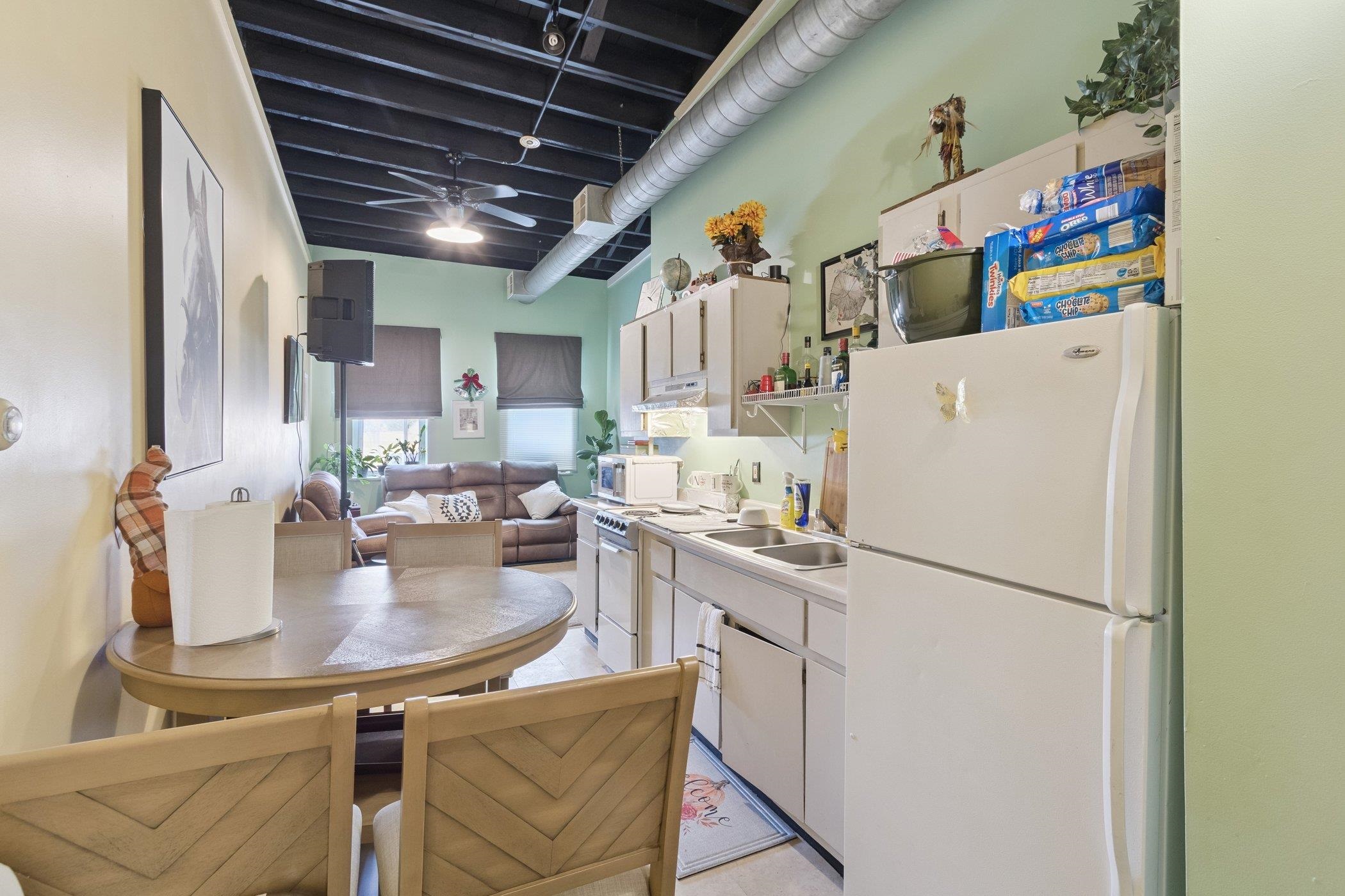 522 South State Street Belvidere, IL 61008 - Photo 42 of 67 a kitchen with a sink a refrigerator and a stove