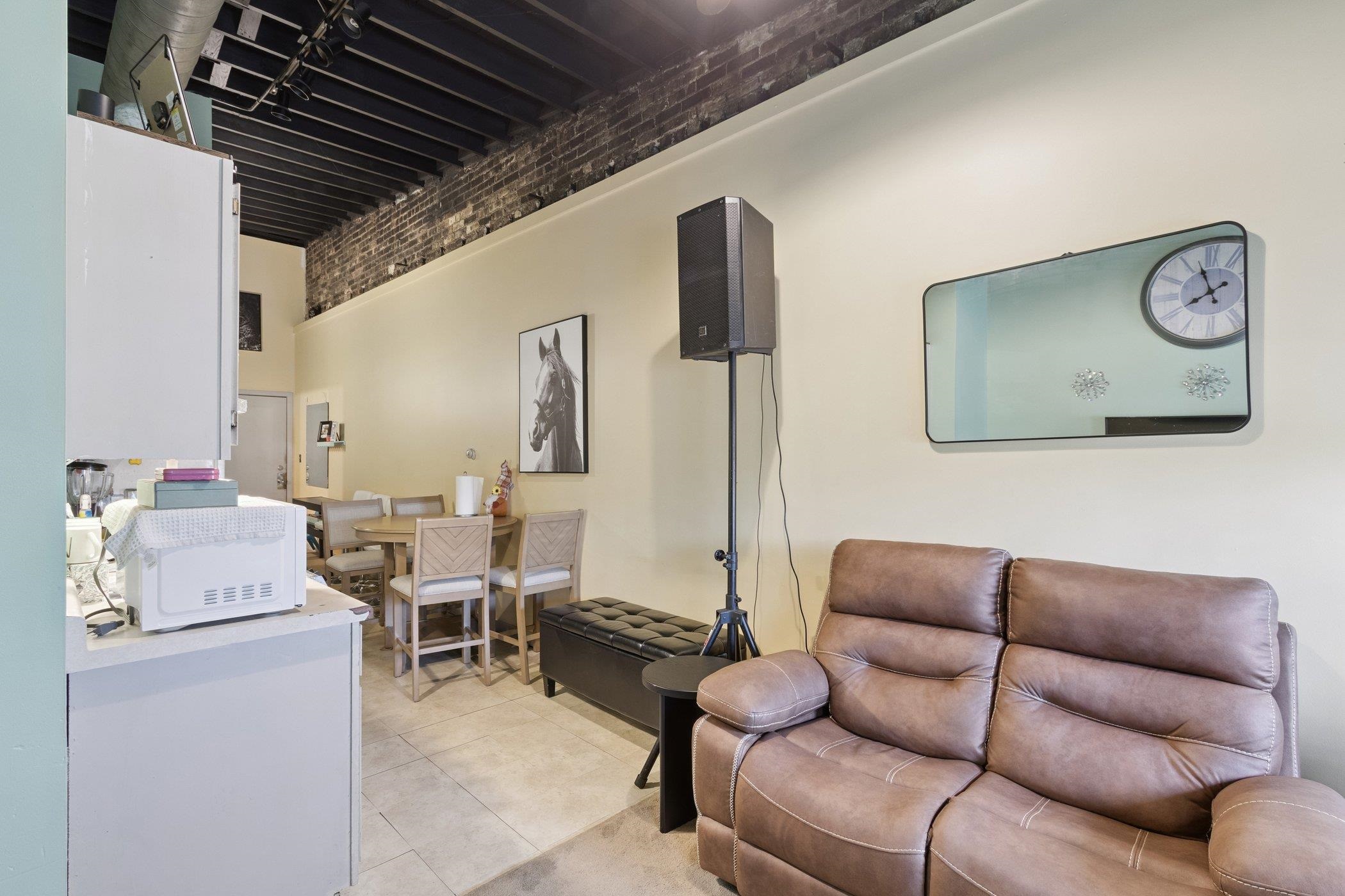 522 South State Street Belvidere, IL 61008 - Photo 46 of 67 a living room with furniture a clock on wall and a table