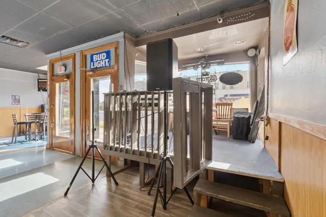 a living room with furniture pool table and a rug
