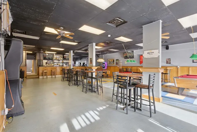 a patio with a table and chairs